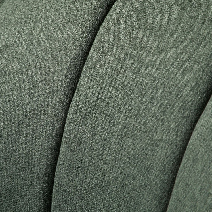Fauteuil en tissu arrondi vert cèdre